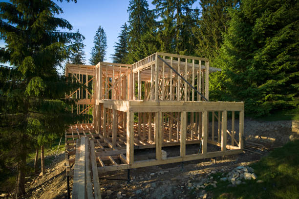 istock Wooden frame house under construction near forest. 1480912157