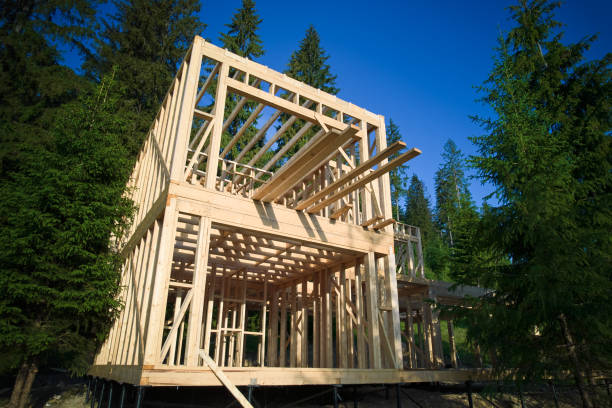 istock Wooden frame house under construction near forest. 1480912160