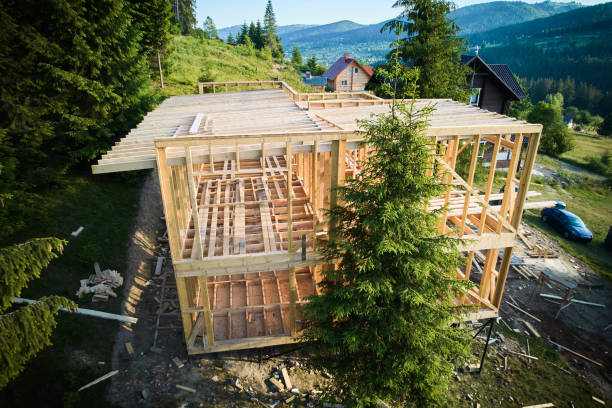istock Wooden frame house under construction near forest. 1480912163