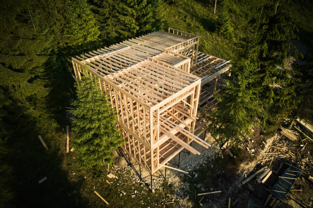 istock Wooden frame house under construction near forest. 1480912166