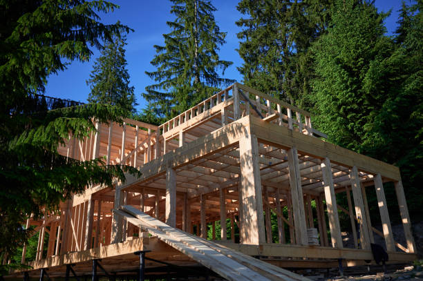 istock Wooden frame house under construction near forest. 1480912170