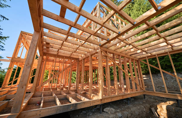 istock Wooden frame house under construction near forest. 1480912173