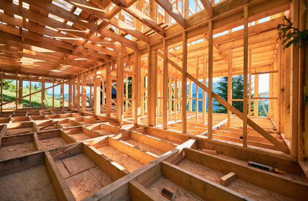 istock Wooden frame house under construction near forest. 1480912184