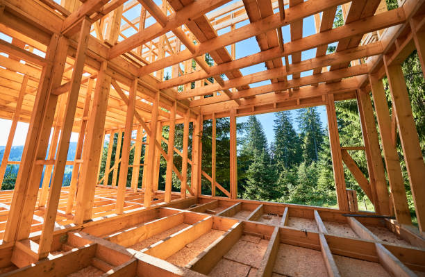 istock Wooden frame house under construction near forest. 1480912185