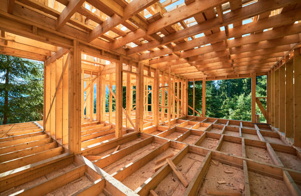 istock Wooden frame house under construction near forest. 1480912197