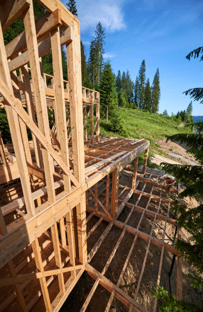 istock Wooden frame house under construction near forest. 1480912204