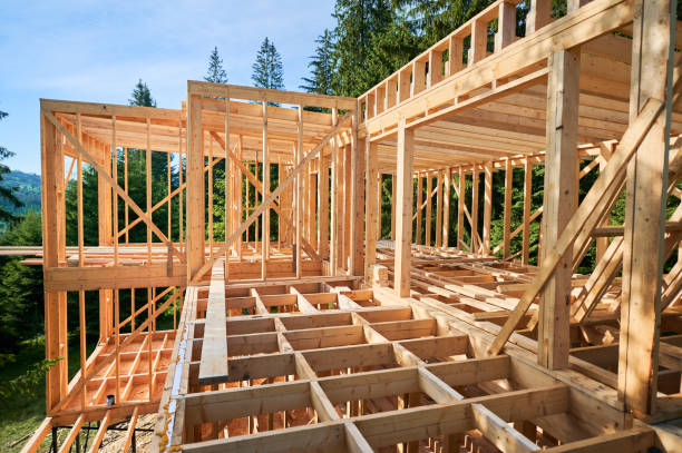 istock Wooden frame house under construction near forest. 1480912211