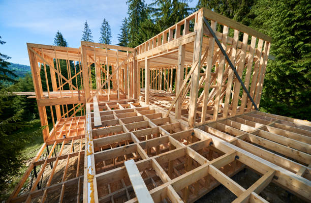 istock Wooden frame house under construction near forest. 1480912221