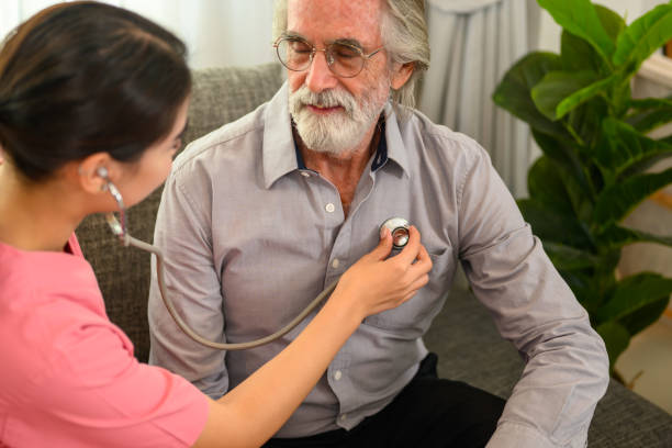 istock Happy female doctor with stethoscope visiting patient 1480913208