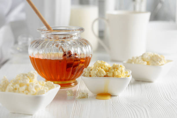 istock Fresh homemade cottage cheese with honey. 1480916967