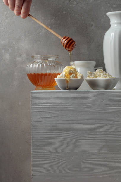 istock Fresh cottage cheese or ricotta with honey. 1480916978
