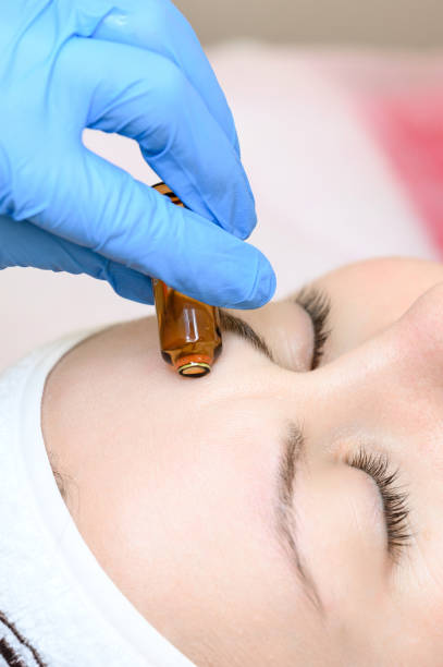 istock Ampoule with vitamin C for application directly to the face for the mesotherapy procedure with the help of a dermapen. 1480920016