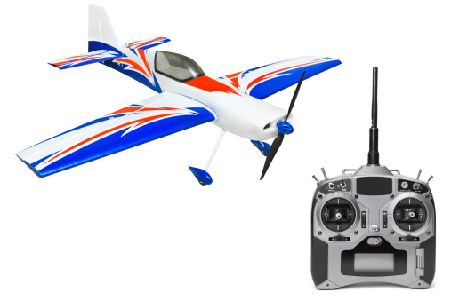 RC plane and radio remote control isolated on white background