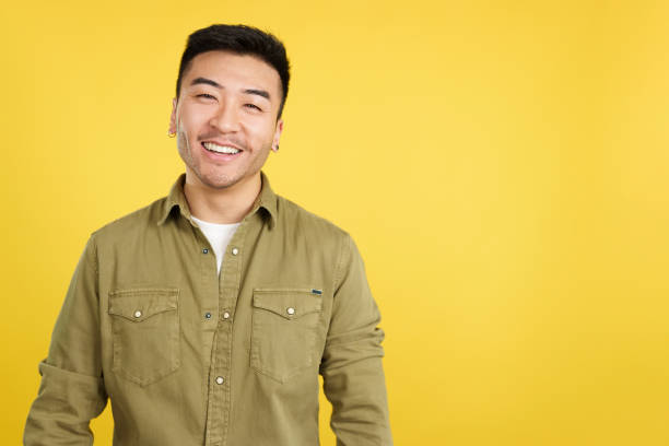 Happy chinese man smiling at the camera