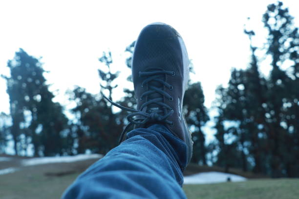 istock man's feet in sneakers 1480921386
