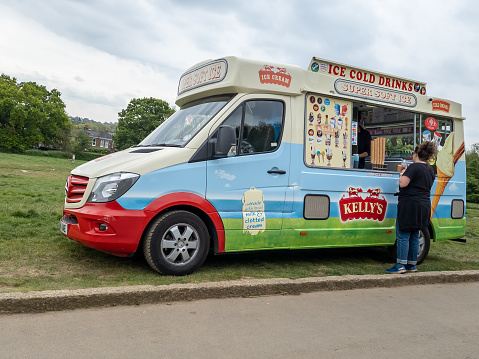 Liverpool, United Kingdom - June 11, 2015: Tourists buying ice cream from an ice cream van, Liverpool, Merseyside, England, UK, Western Europe.