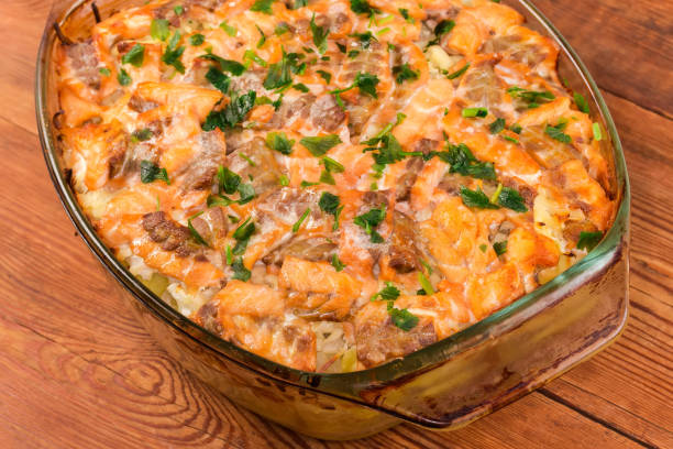 istock Vegetable casserole with salmon slices with greens in baking dish 1480922680