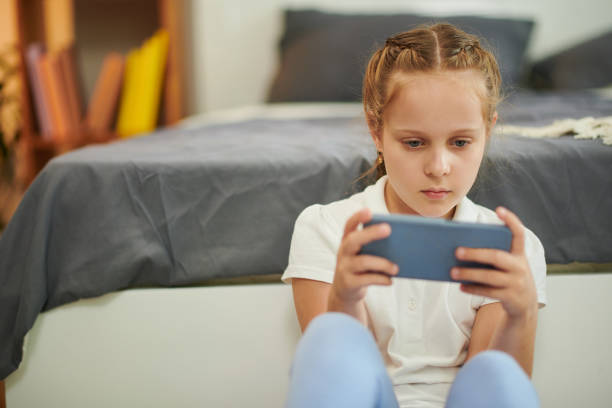 istock Girl Playing Videogame 1480925374