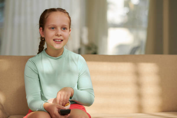 istock Girl Watching Favorite Show 1480925395