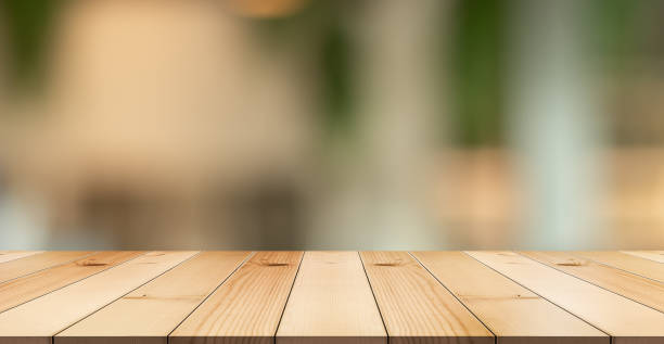 istock Empty wooden table top with lights bokeh on blur restaurant background. 1480928698