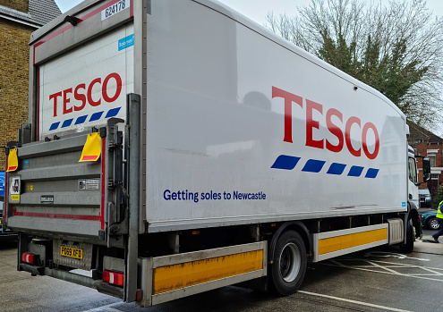 London. UK. 02.02.1021. A distribution truck of Tesco supermarket with the company name and logo on the side and back.