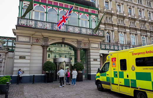 London. UK- 05.23.2021. Exterior view of The Clermont Hotel in Charing Cross with a emergency ambalance outside.