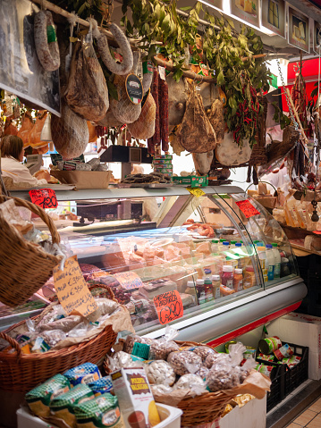 Rome, Italy - November, 2014: scenery of butchery in a local market, Iberia hams having on the ceiling