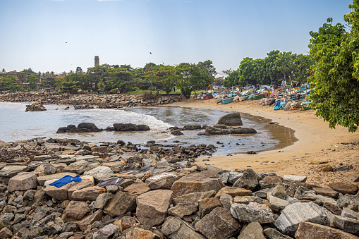 Galle, Sri Lanka - February 11th 2023: Outrigger canoes build of fiberglass used for fishing on a small beach in the outskirts of the old town Galle in Sri Lanka