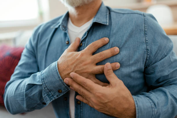 Heart Disease Heart attack, man with chest pain suffering at home, health problems concept male chest pain stock pictures, royalty-free photos & images