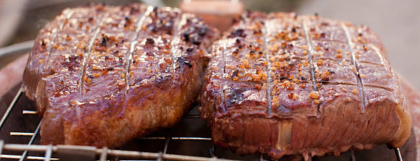 steak on the grill stock photo