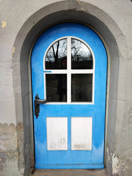 blue door at an old house stock photo