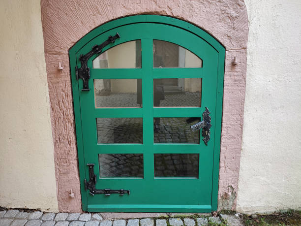green door at an old house stock photo