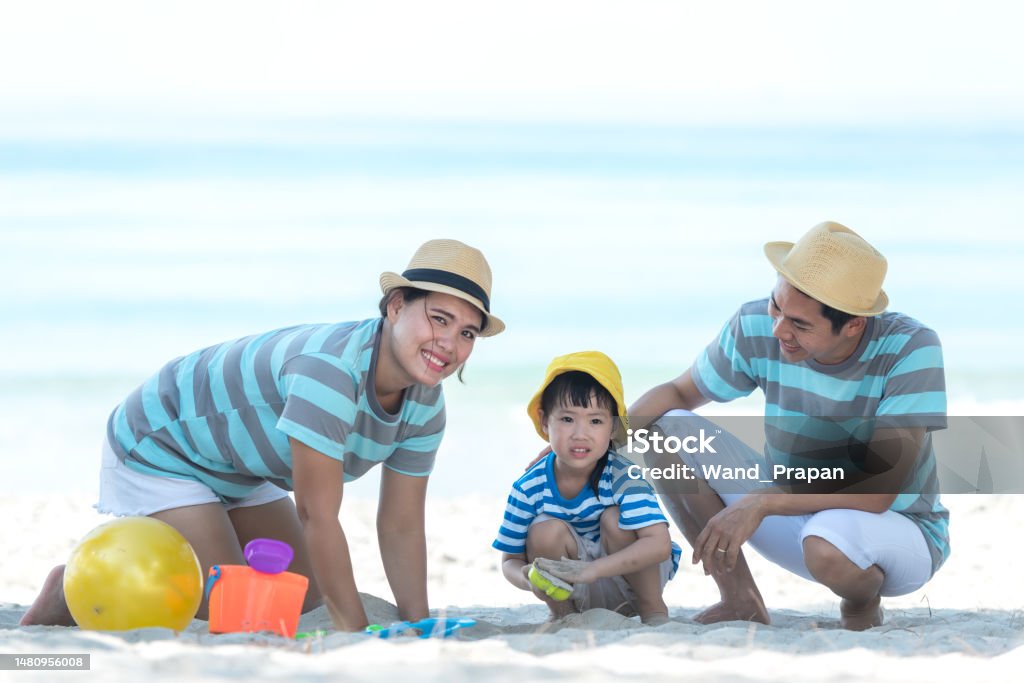 Happy family summer sea beach vacation. Asia young people lifestyle travel enjoy fun and relax leisure destination in holiday. Travel and Family Concept Active Lifestyle Stock Photo