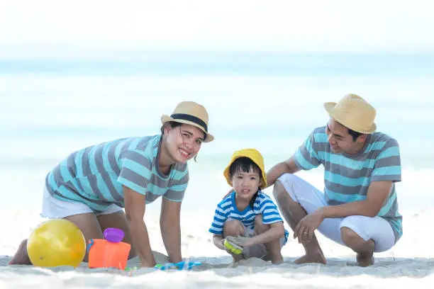 Happy family summer sea beach vacation. Asia young people lifestyle travel enjoy fun and relax leisure destination in holiday. Travel and Family Concept