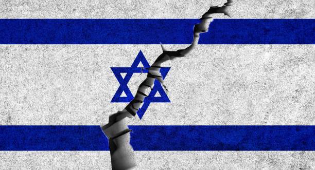 istock Israel flag on cracked wall background. Israel conflicts, political division, crisis, war concept. 1480956791