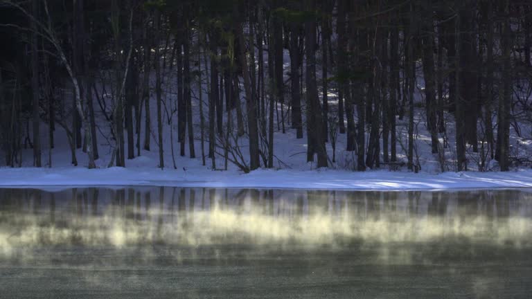 MIshaka Pond on a winter morning. Lake ice fog glowing in the morning sun