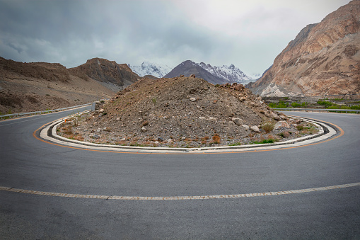 The Karakoram Highway, which is one of the highest paved roads in the world, runs alongside the Passu Glacier and turns around a mound of rocks. This mound adds an interesting element to the already impressive landscape and is a popular spot for tourists to stop and take pictures.\nThe Upper Hunza region is renowned for its natural beauty and is a popular destination for trekking and mountaineering enthusiasts. Visitors can explore the stunning landscape, including the glacier, by foot or by car, and take in the awe-inspiring scenery that this area has to offer.