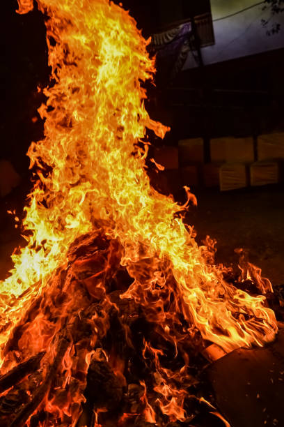 istock Fire flames on black background, Blaze fire flame texture background, Beautifully, the fire is burning, Fire flames with wood and cow dung bonfire 1480967710