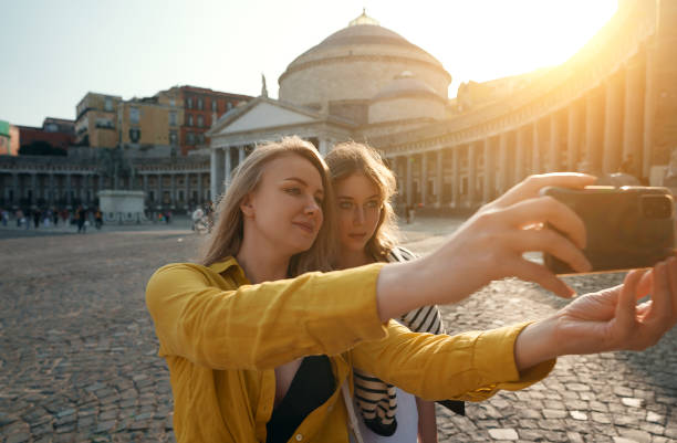istock Two female tourists making selfie on Piazza del Plebiscito. 1480971002