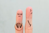 Fingers art of couple. Concept woman made an offer to get married, man refused.