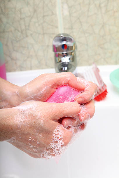 istock Woman wash soapy hands in bathroom 148097818