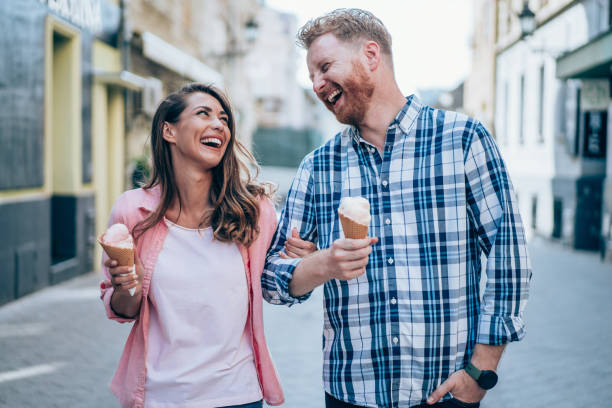 istock Lovely couple eating ice cream together. 1480979139