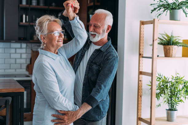 istock Couple dancing in living room. 1480979163