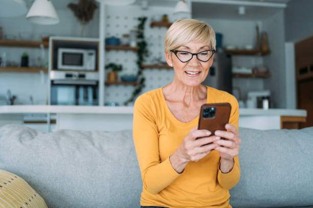 istock Cheerful woman having video call at home. 1480979200