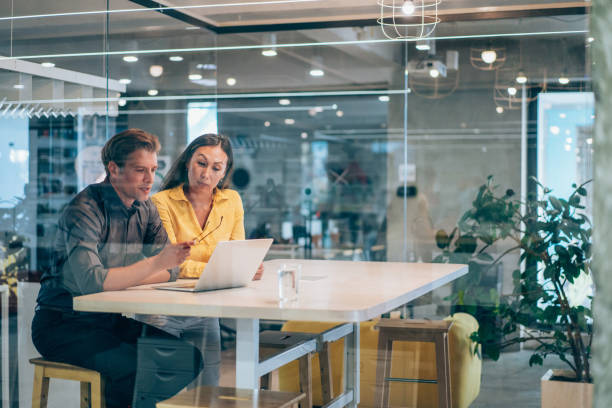 business partners in meeting. - laptop partnership looking communication imagens e fotografias de stock