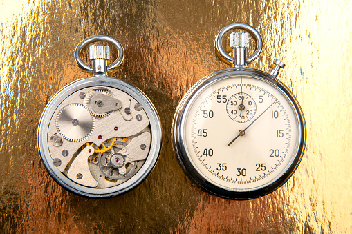 mechanical analog stopwatch on a colored background. Time part precision. Measurement of the speed interval