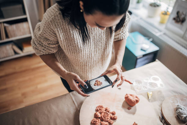 istock Woman taking pictures of her work 1480981524