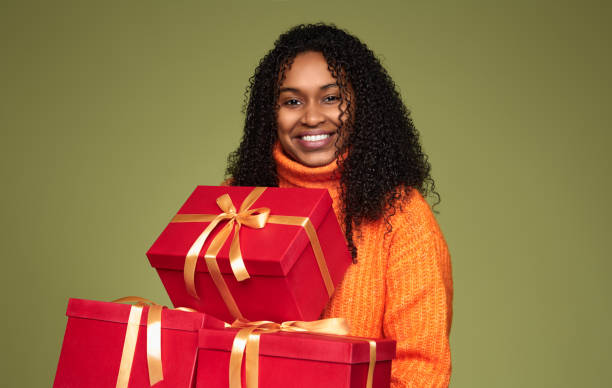 istock Smiling ethnic woman with gift boxes 1480981808