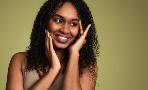 istock Cheerful black woman touching cheeks 1480981817