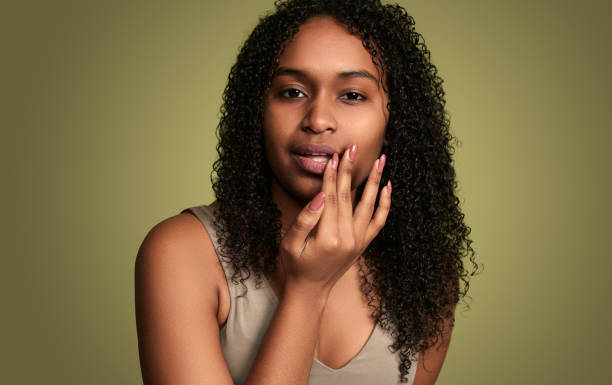 istock Concerned black woman touching lips 1480981819